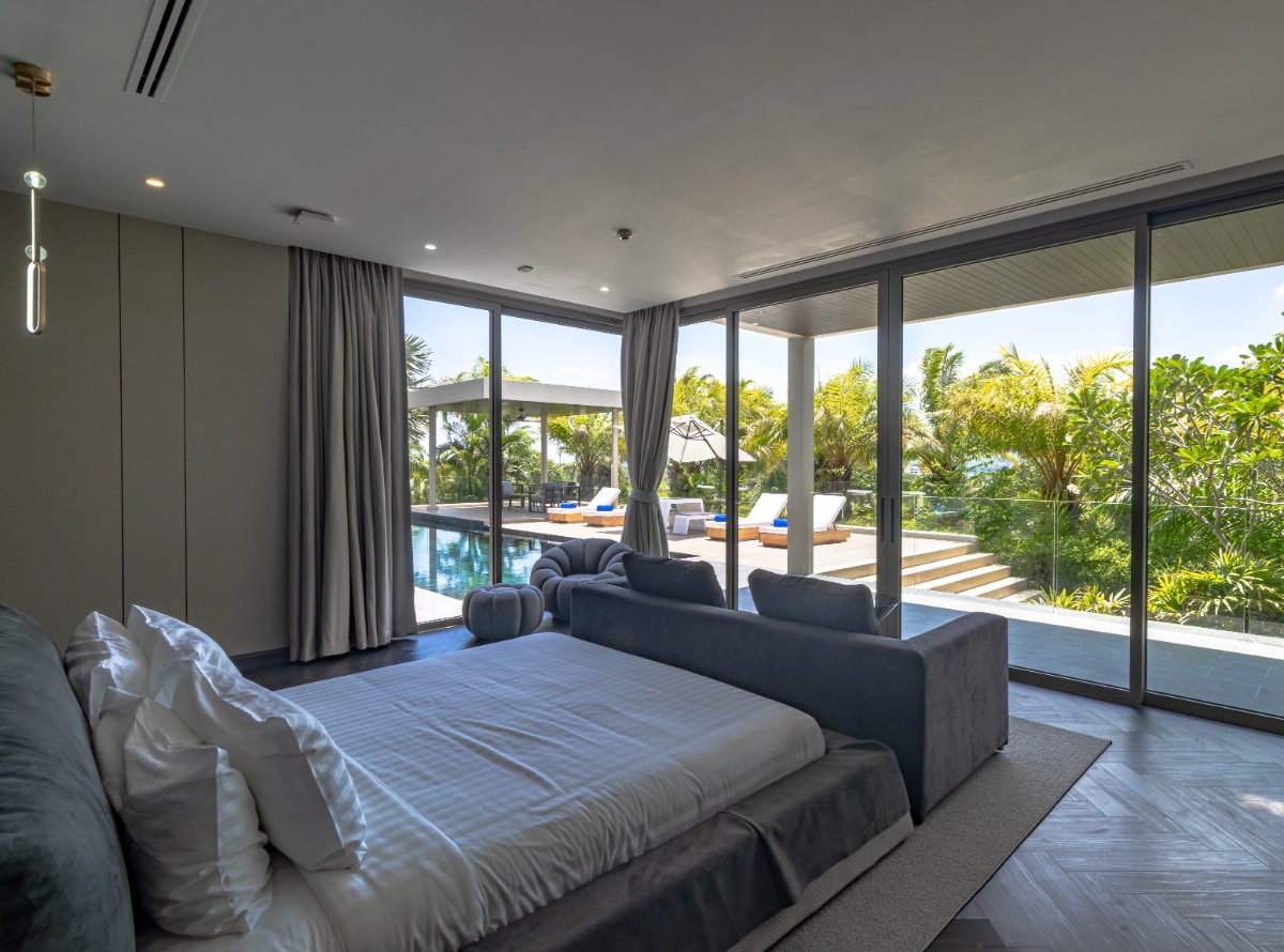 Pool-facing guest bedroom at Villa Lion